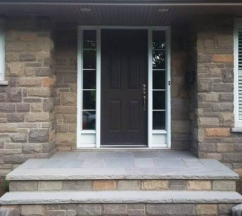 Square cut sandstone flag entrance and faux coursing central London.